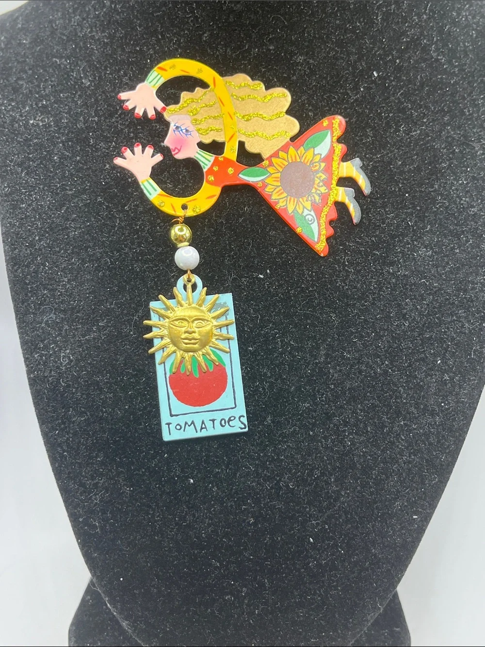 Signed Rossi flying lady stick pin brooch with a tomato sign